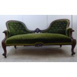 A mid Victorian carved walnut, showwood framed, double spoonback settee with floral,