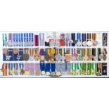 Approximately fifty-five police and other enforcement associated medals, many on ribbons,