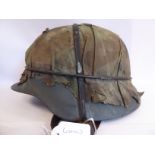 A World War II German Army steel helmet,