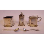 A three piece silver condiments set of chamfered box design comprising a pepper pot,