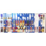 Approximately thirty-eight police and other enforcement associated medals, many on ribbons,