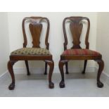 A pair of mid 18thC walnut framed side chairs, each with a solid, vase shaped back and drop-in seat,