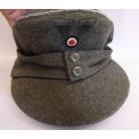 A World War II German Army ski cap with silver coloured braid,