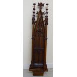 A late 19thC carved walnut and oak hanging niche, in Gothic taste, featuring a pointed arch,