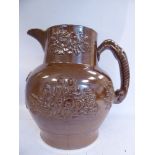 A mid 19thC salt glazed stoneware harvest jug, having an upstand neck and hound handle,
