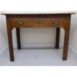 An early 19thC oak architect's table, the mitred top over a shallow, compartmented drawer,