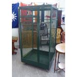 An enamelled green painted, square section, tubular steel framed, wire panelled,