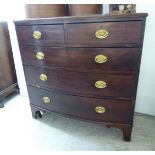 An early 19thC mahogany bow front dressing chest,