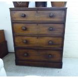 A late Victorian mahogany dressing chest, the four graduated long drawers with bun handles,