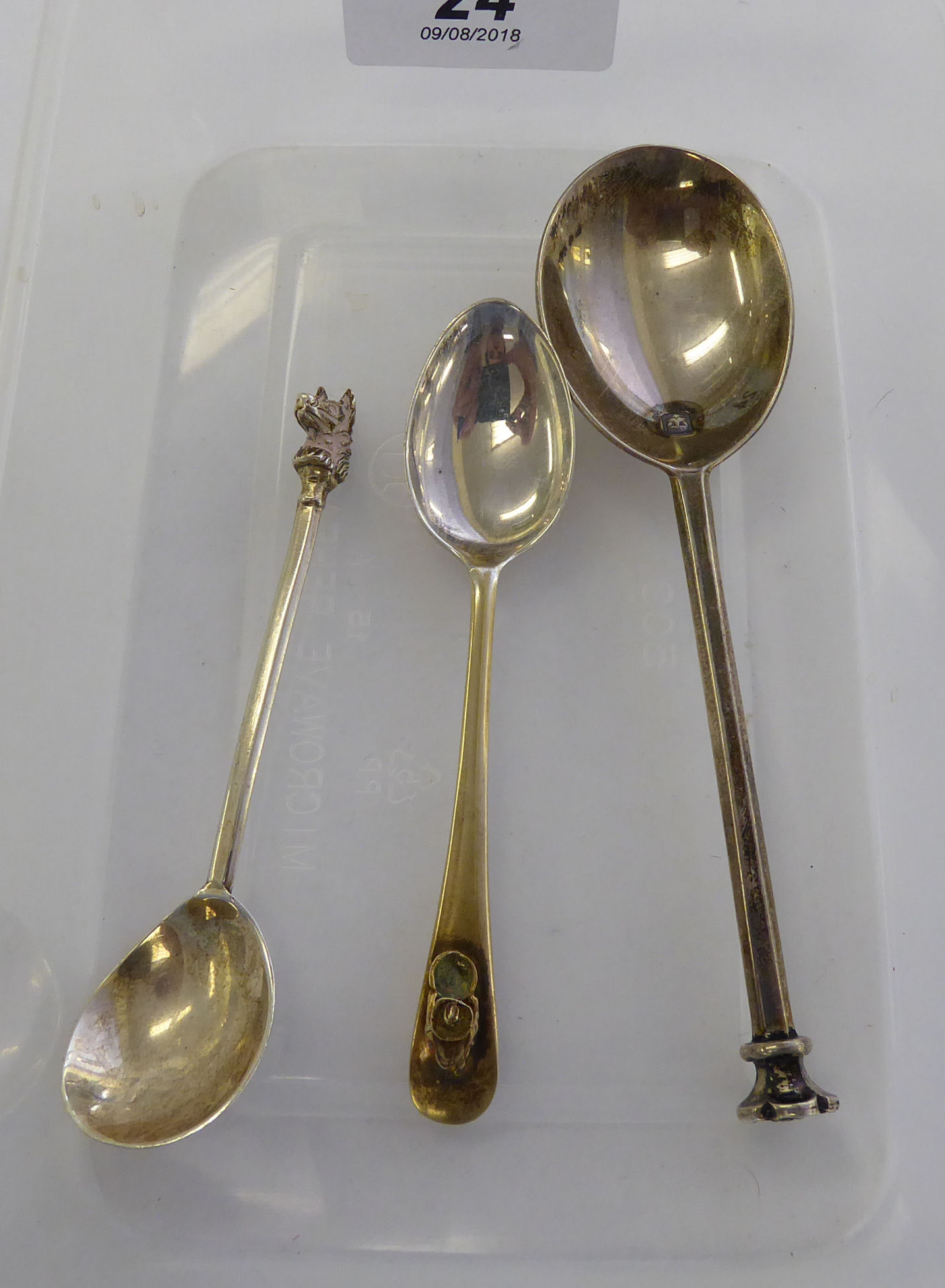 A silver and parcel gilt Old English pattern coffee spoon,