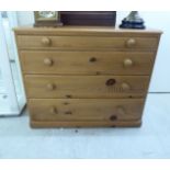 A modern honey coloured pine chest,