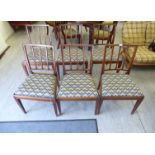 A set of six Edwardian mahogany framed dining chairs with square, vertically railed backs,