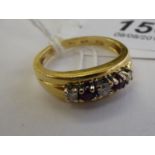 An 18ct gold claw set ruby and diamond ring 11