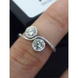 An 18ct white gold two stone,
