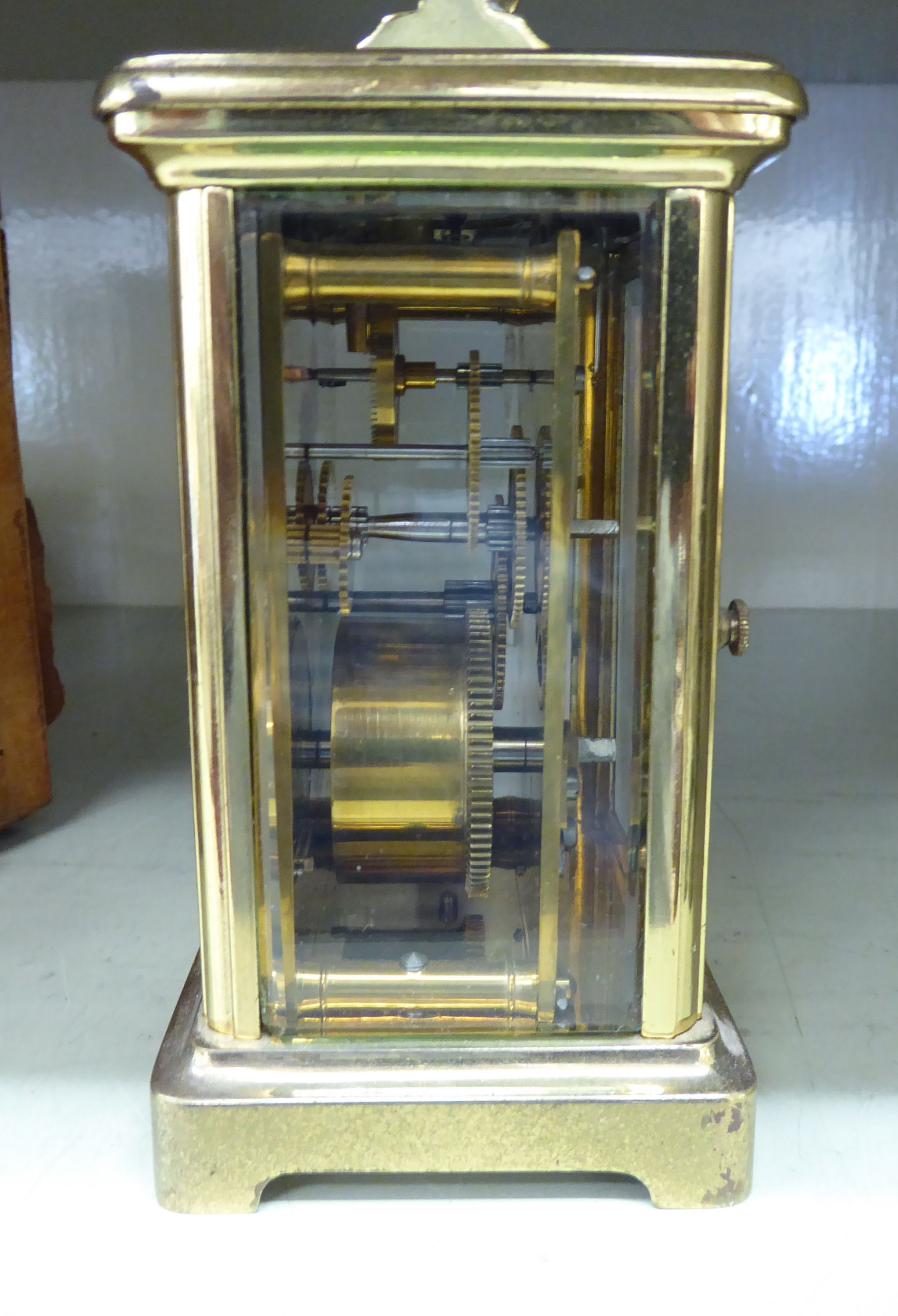 A mid 20thC lacquered brass cased carriage timepiece with bevelled glass panels and a folding top - Image 2 of 2