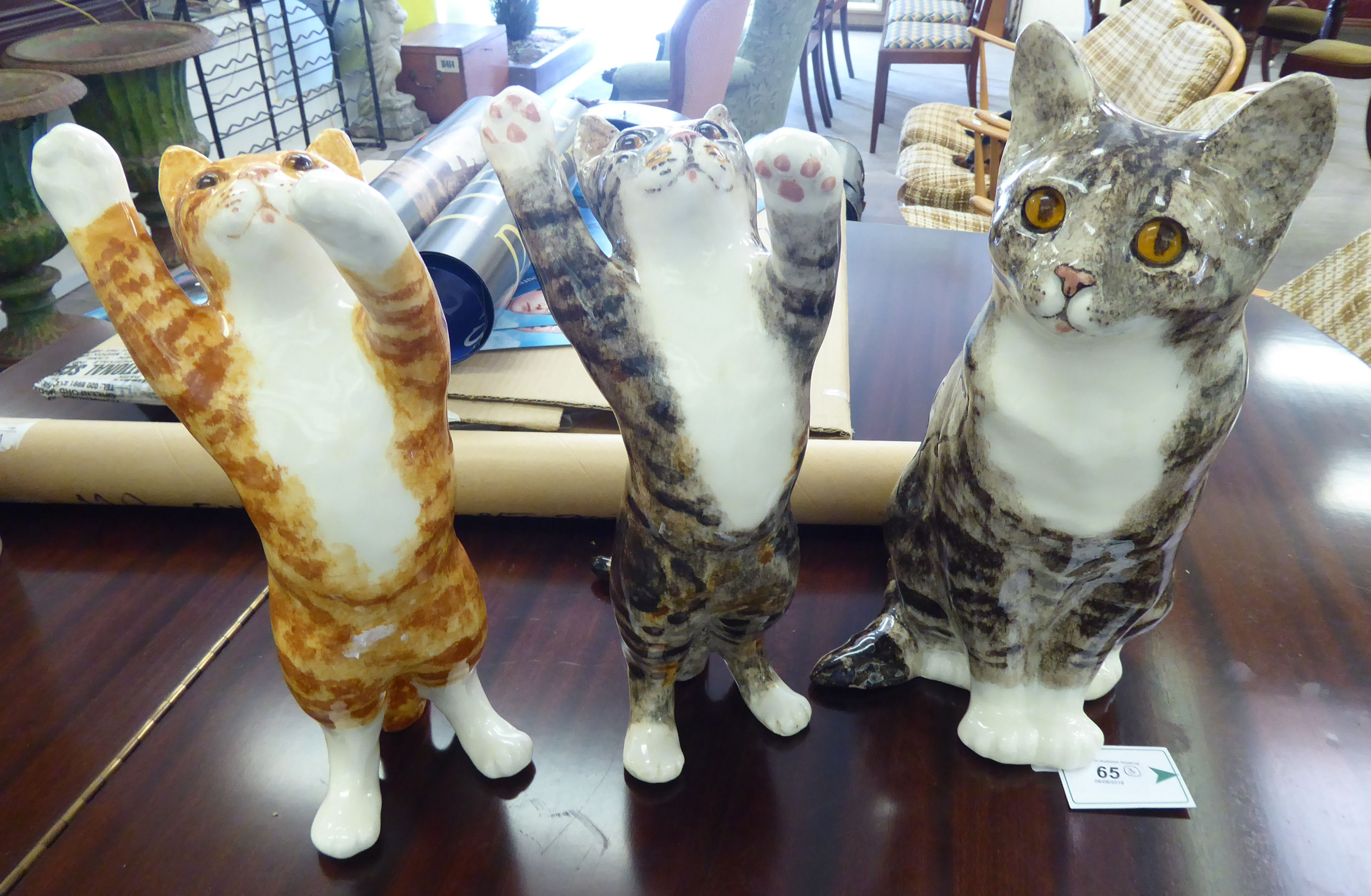 Three Winstanley pottery model cats: to include a resting tabby 7''h RAF