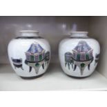 A pair of 20thC Chinese crackle glazed porcelain bulbous vases with narrow, rolled necks,