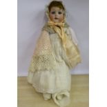 An early 20thC Heubach Koppelsdorf bisque head doll with painted features and weighted sleeping