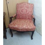 An early 20thC stained and carved beech showwood framed salon chair,