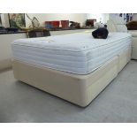 A two-part divan bed with drawers;