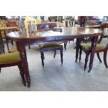 A late Victorian/early Edwardian mahogany wind-out dining table,