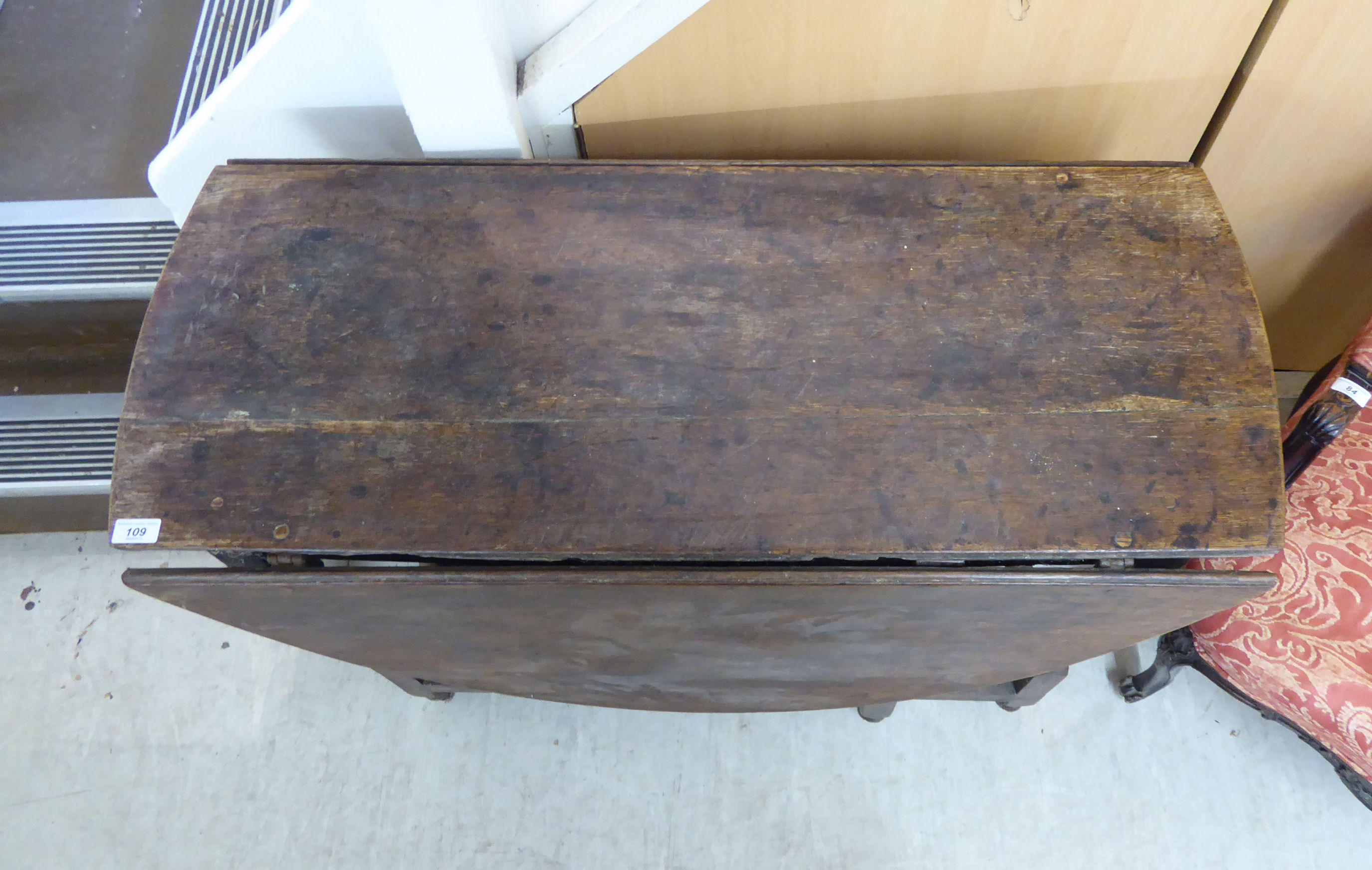 A George III stained oak drop leaf table, raised on baluster and block supports, - Image 2 of 2