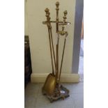 A modern Victorian style brass three piece fireside companion set and stand 30''h SR