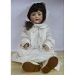 An early 20thC Heubach Koppelsdorf bisque head doll with painted features and weighted sleeping