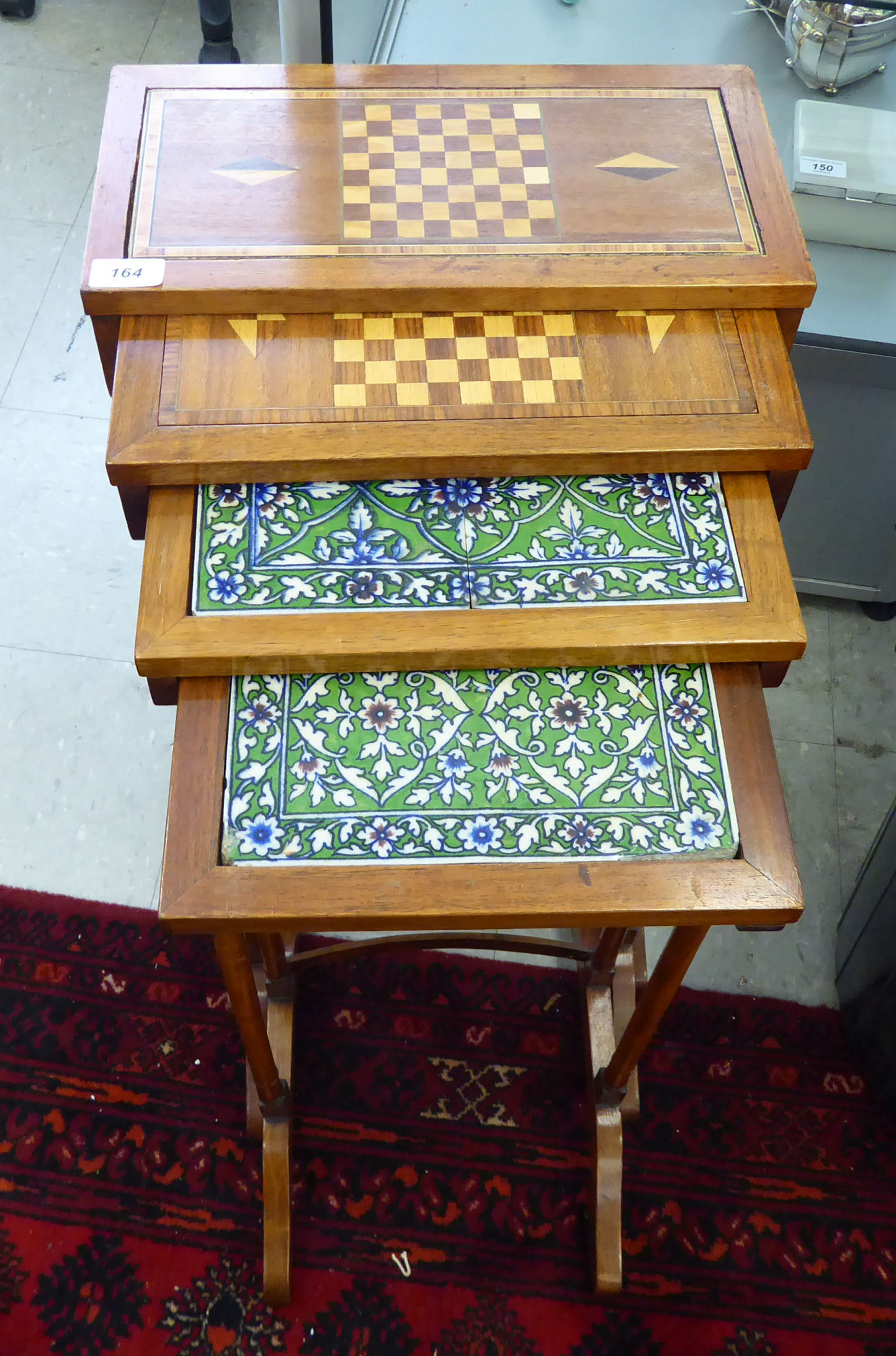 A 20thC quartetto of teak occasional tables, the two larger with inlaid chequerboard tops, - Image 2 of 2
