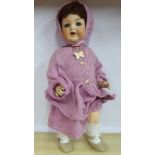 An early 20thC Armand Marseille bisque head doll with painted features and weighted sleeping eyes,