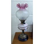 A late Victorian oil lamp with a double wick burner,