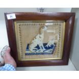 A 19thC needlework tapestry, featuring a seated dog with a cat,