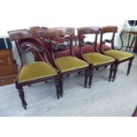 A set of four late Regency mahogany framed dining chairs with curved,