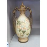 A late 19thC Turn, Austrian pottery ovoid shaped china vase with stylised handles and a domed cover,