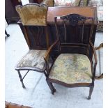 An Edwardian bone inlaid and carved mahogany framed open arm salon chair,