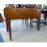 A mid Victorian satin mahogany Pembroke table, the top with a thumb moulded edge,