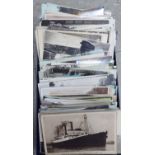 An uncollated collection of monochrome and coloured picture postcards,