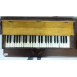 An early 20thC J & J Goddard, oak cased tabletop piano 29.