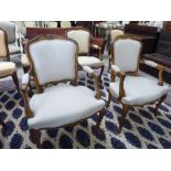 A pair of modern French inspired beech showwood framed elbow chairs,