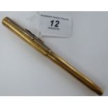 A Swan engine turned 9ct gold cased fountain pen with a 14ct nib 11