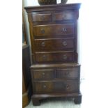 A Reprodux crossbanded mahogany miniature chest-on-chest with four short/four long drawers,
