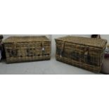 Two similar early 20thC woven cane laundry hampers with buckled hide straps 15''h 30''w BSR