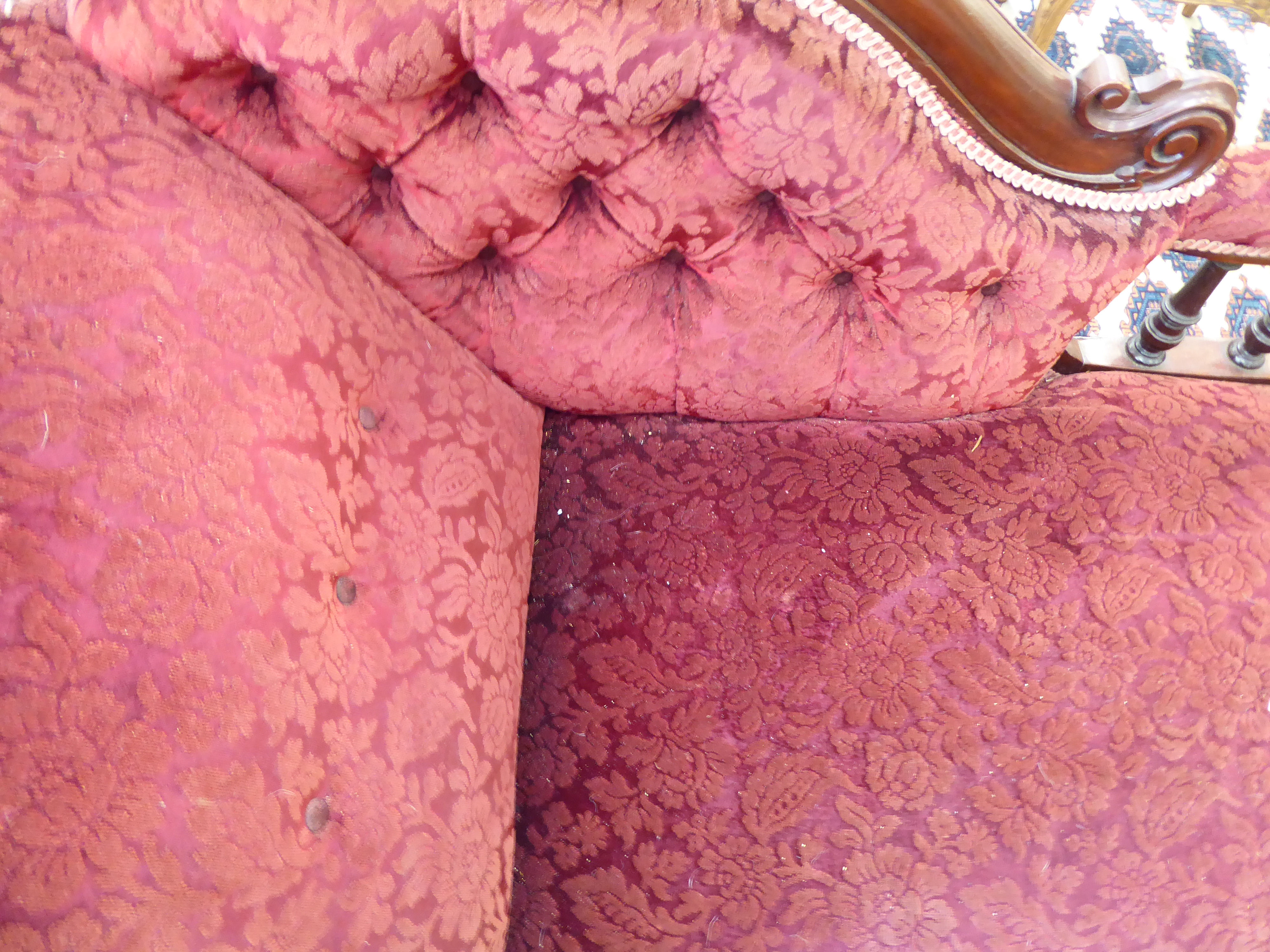 A late Victorian mahogany framed chaise longue, upholstered in a maroon floral fabric, - Image 3 of 4