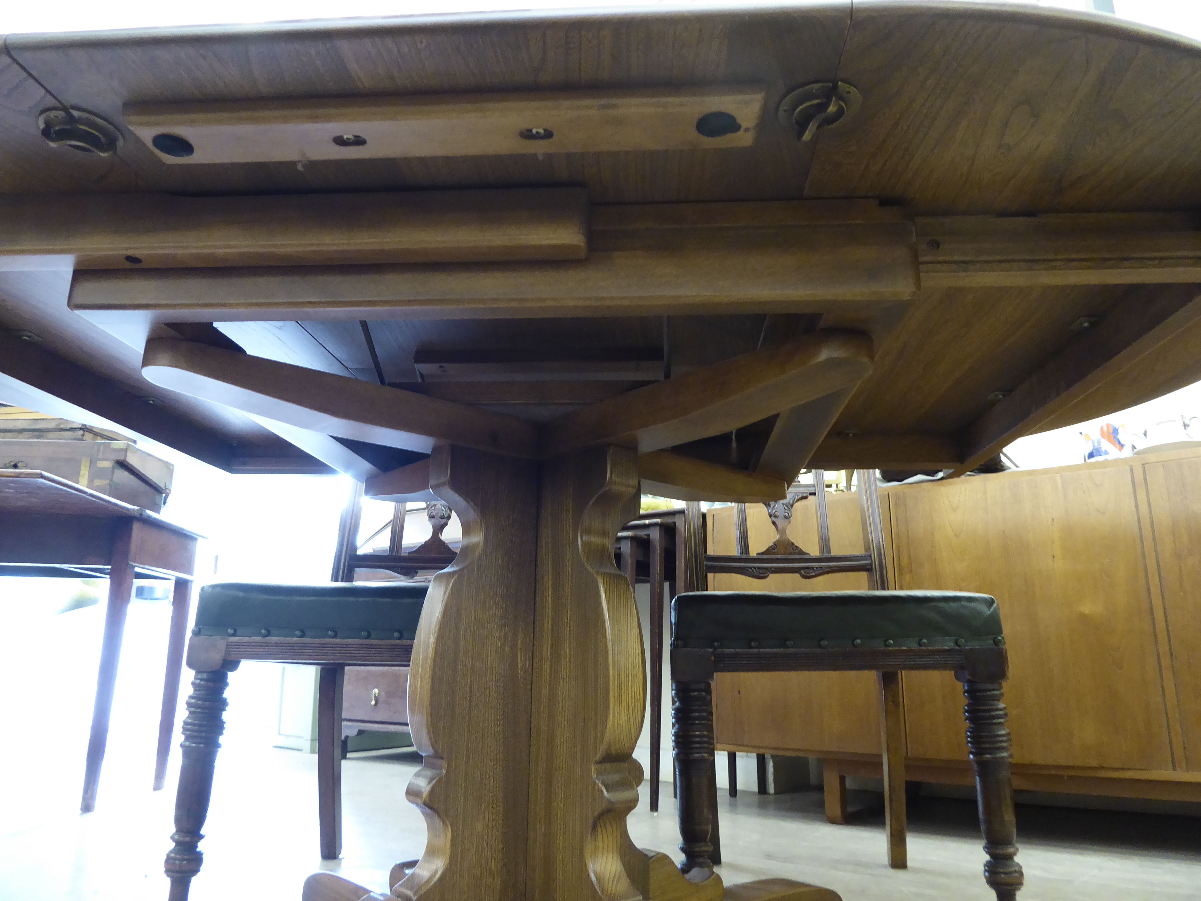 An Ercol elm draw leaf dining table, - Image 3 of 3