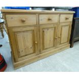 A modern waxed pine dresser, comprising three in-line drawers, over three fielded,