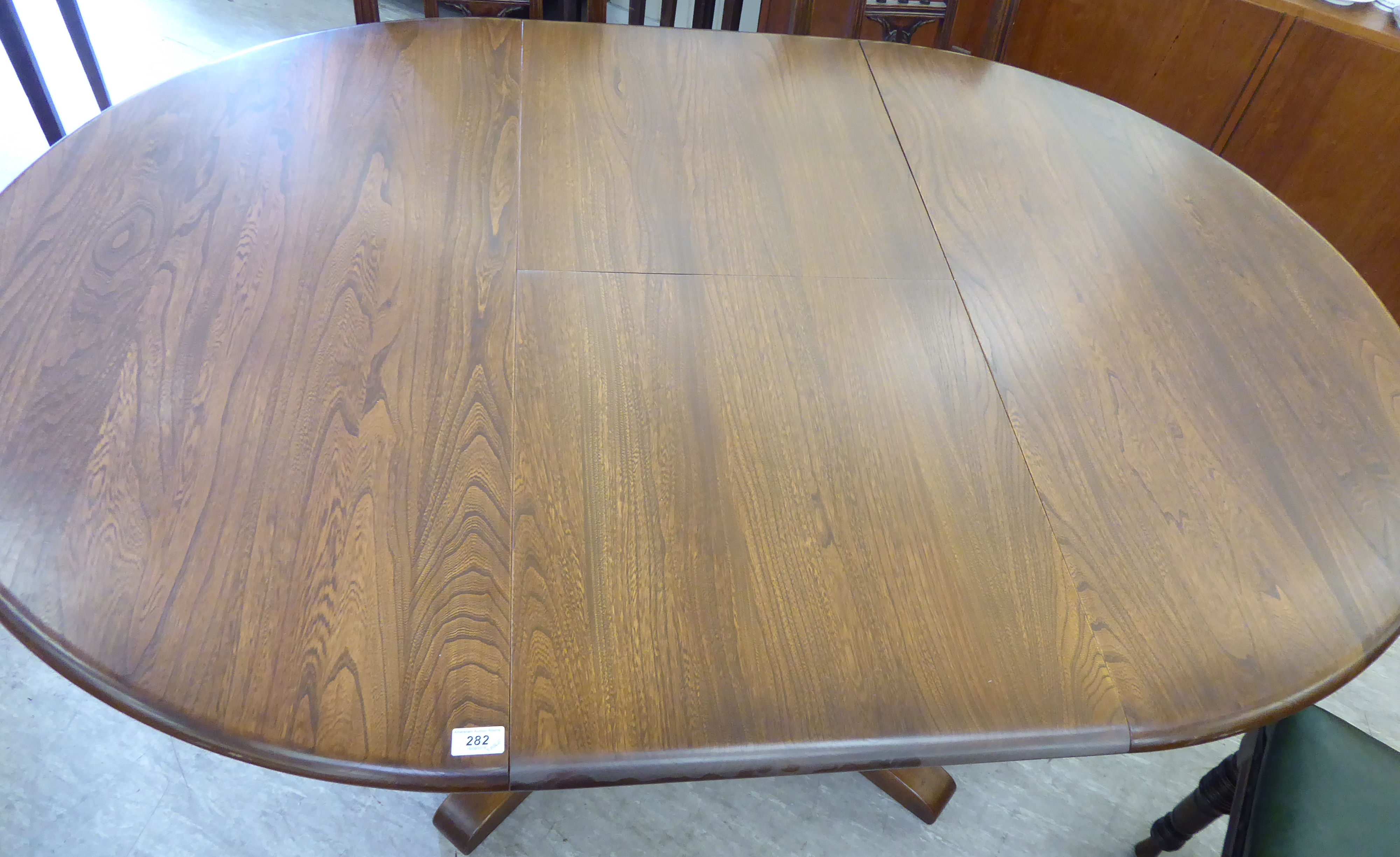 An Ercol elm draw leaf dining table, - Image 2 of 3