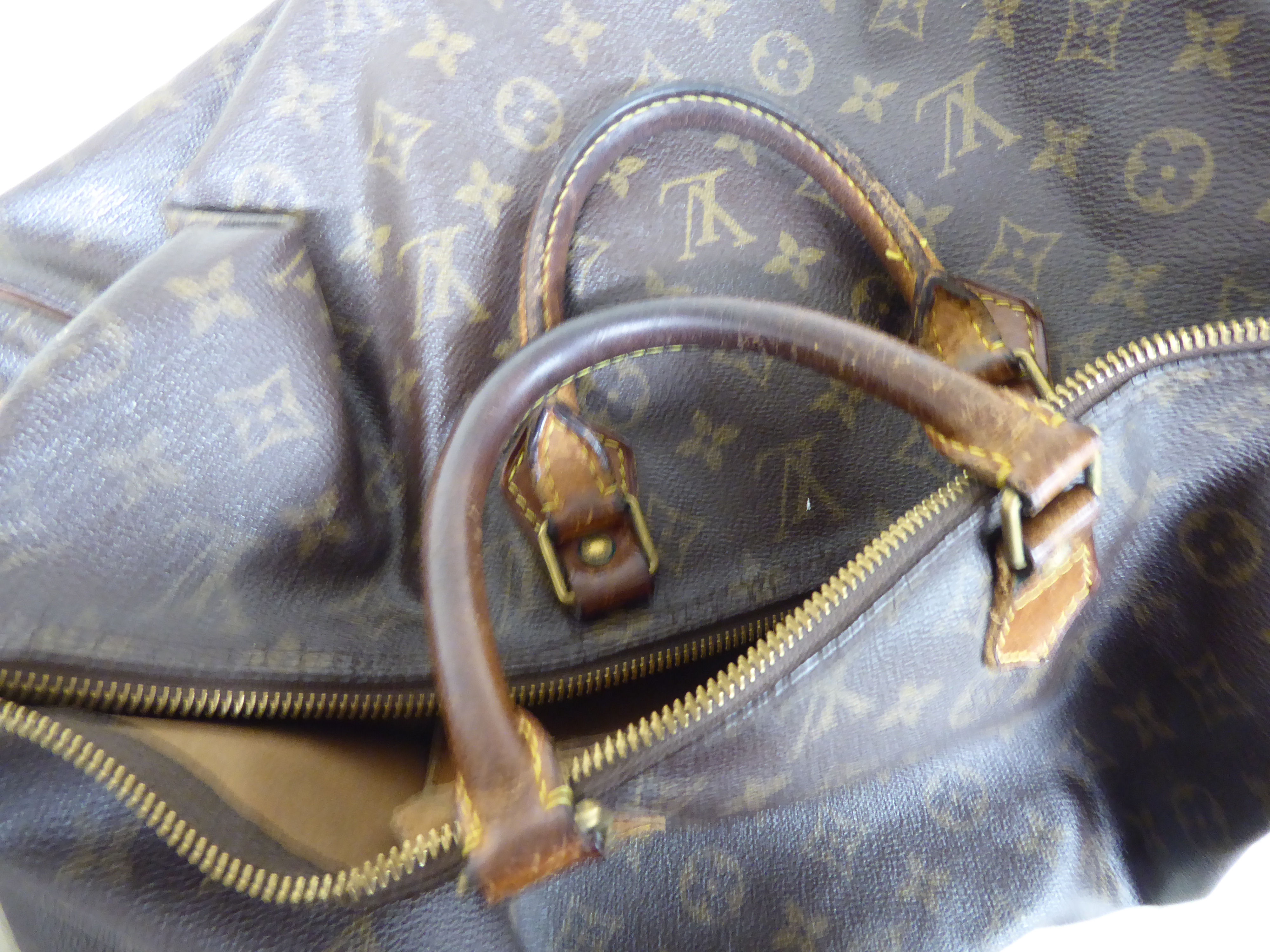 A Louis Vuitton leather holdall/handbag with a zipped opening, - Image 6 of 6