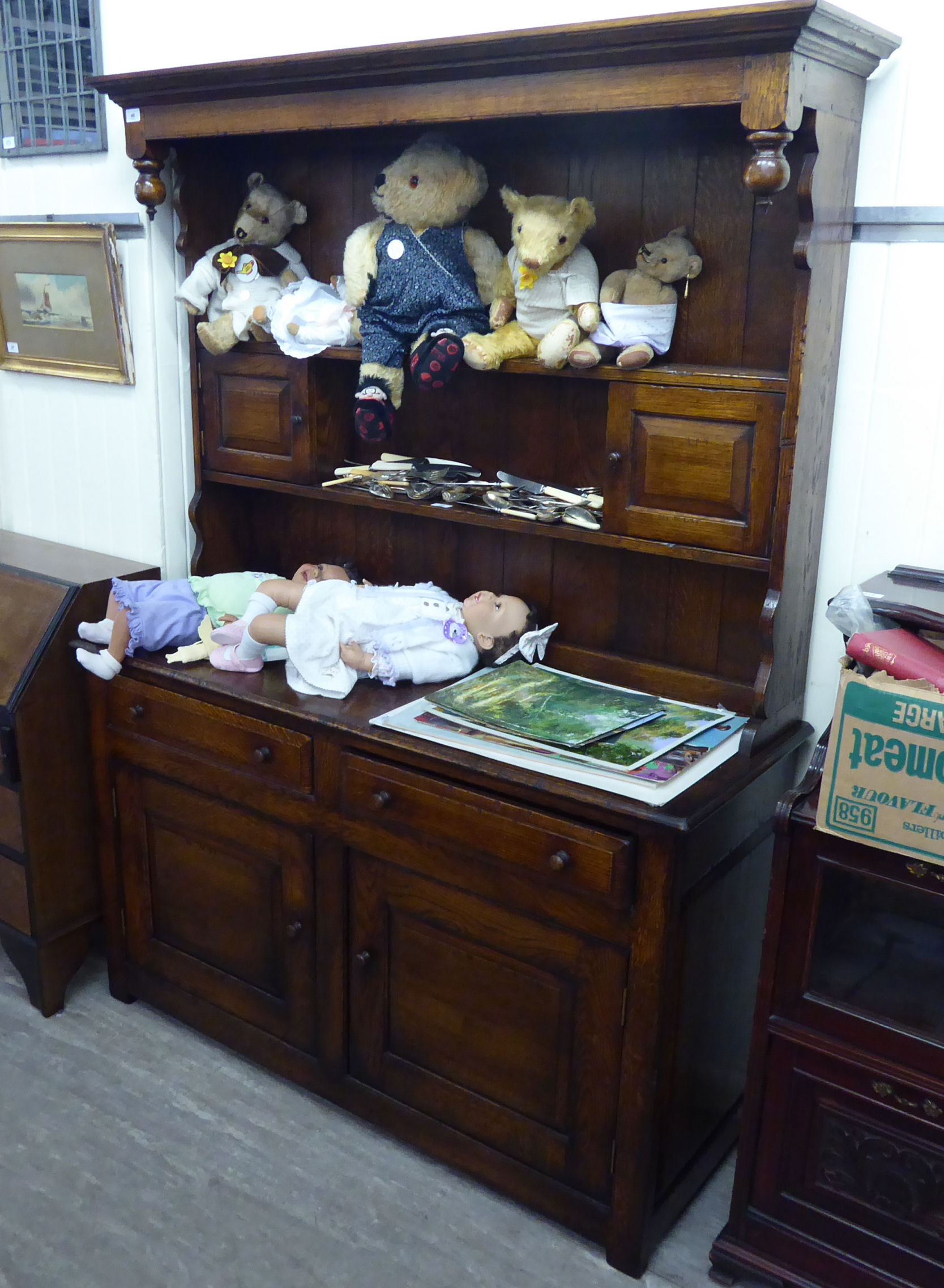 A modern reproduction of an Old English oak dresser,