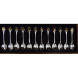 A John Pinches set of twelve silver and parcel gilt presentation spoons, produced for RSPB,