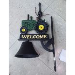 A cast iron door bell, fashioned as a tractor,
